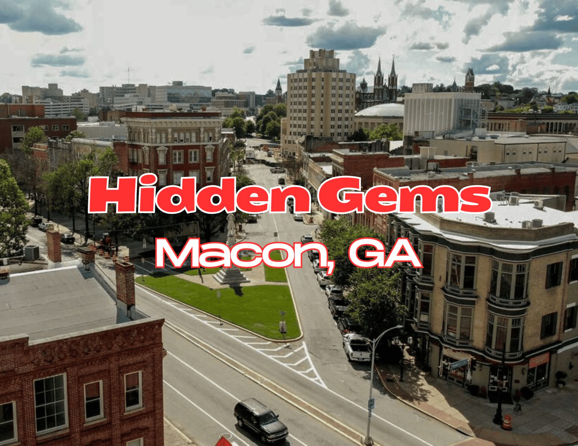 A sunny street view of downtown Macon, Georgia with buildings and cars.